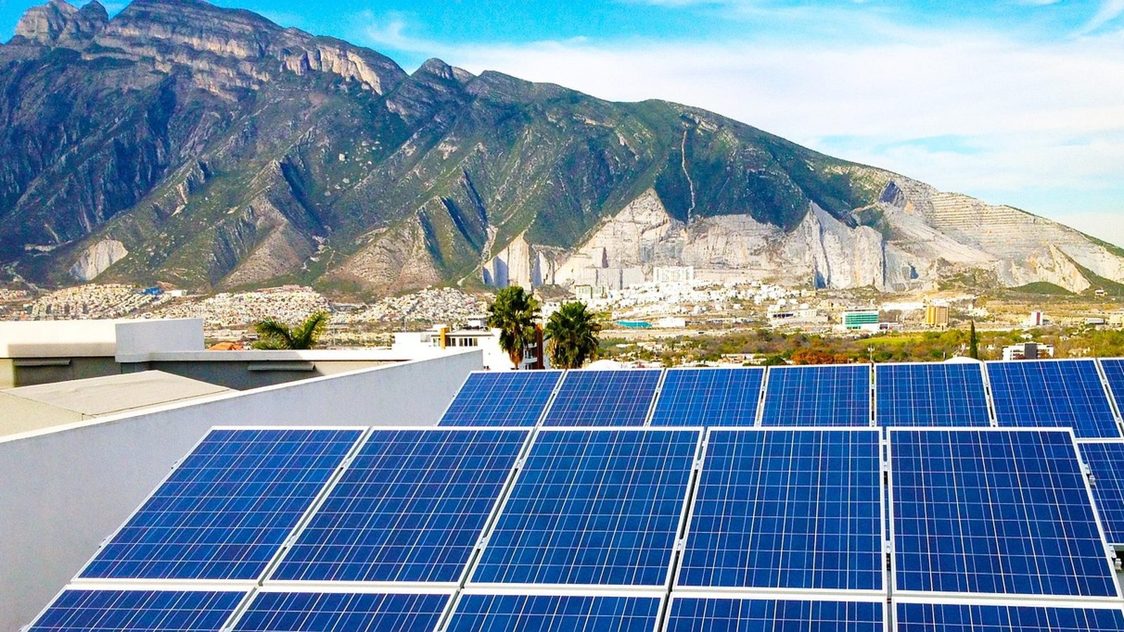 Photovoltaic panels angled toward the sun on a home roof